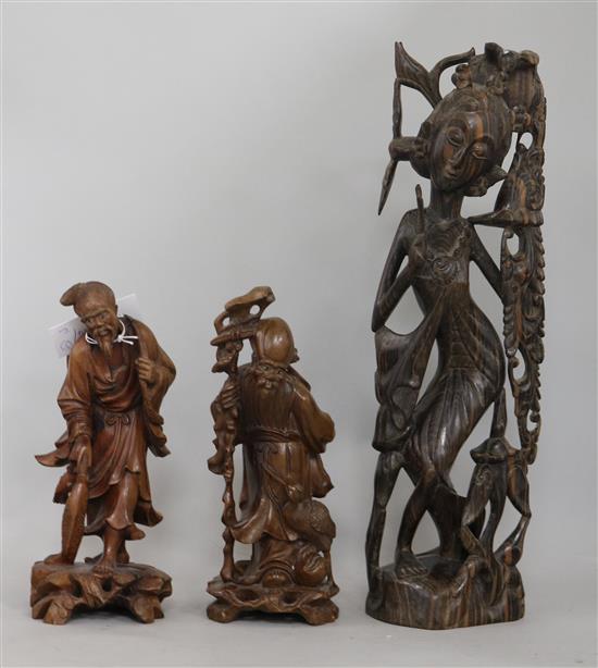 Two Chinese carved figures and another
